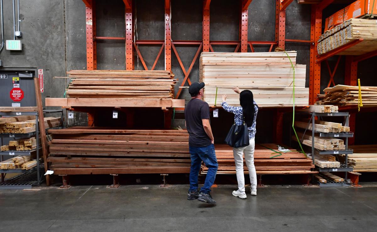 Home Depot's earnings beat estimates, but the CEO notes "continued pressure" on consumers